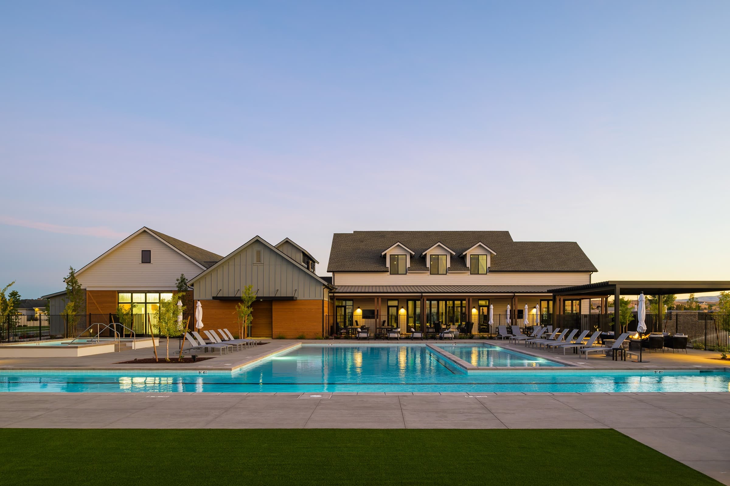 Regence at Milestone Ranch clubhouse and pool at dusk